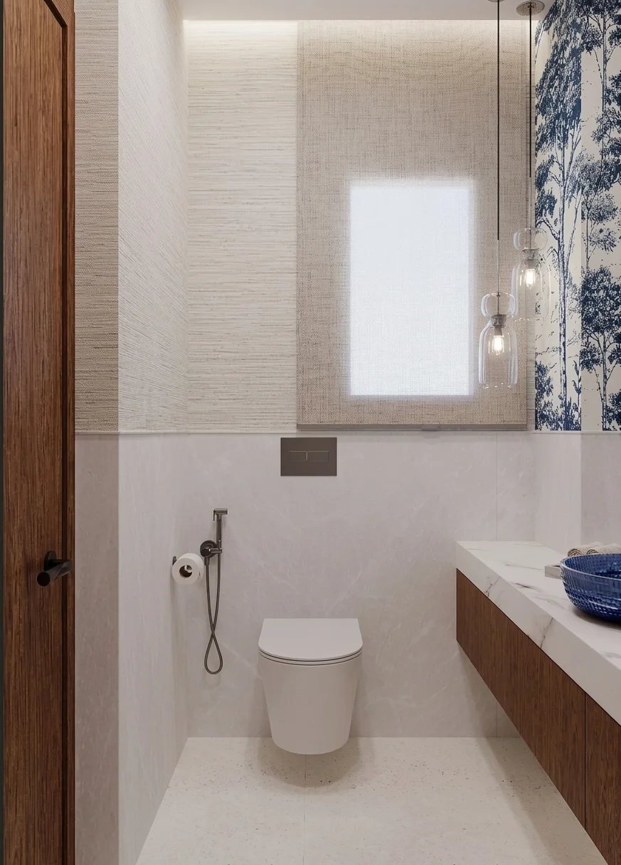 Modern guest bathroom with a wall-mounted toilet, floating wooden vanity, blue vessel sink, and botanical wall pattern.