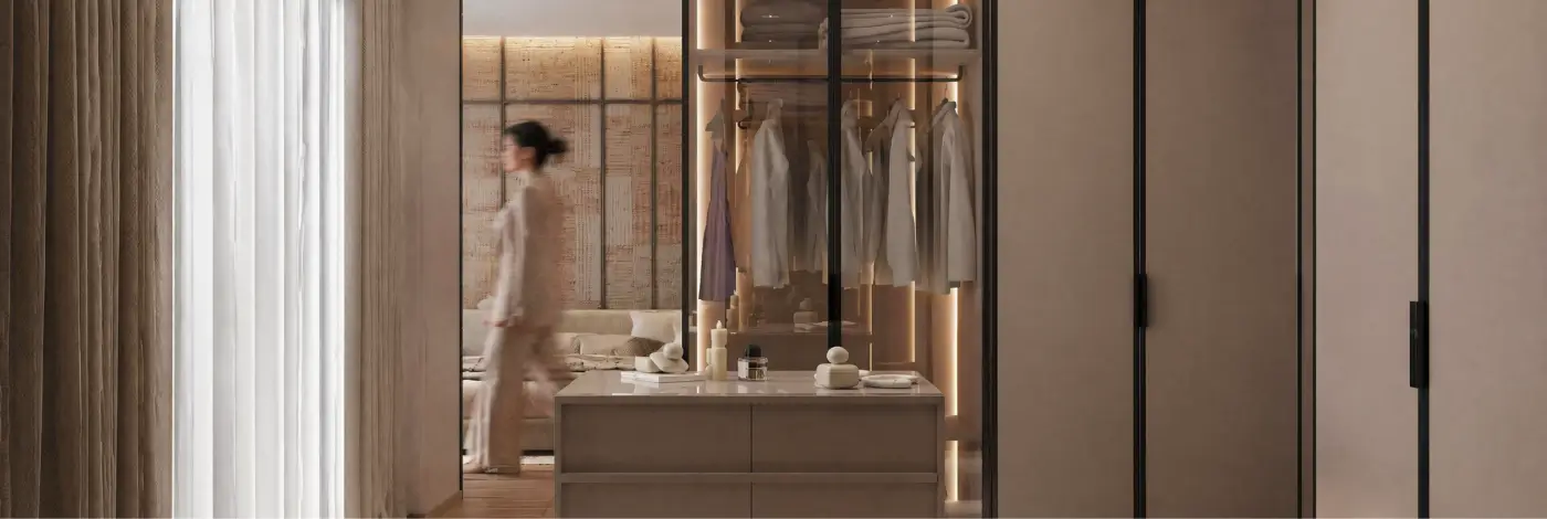 Modern walk-in closet with glass wardrobes and warm lighting