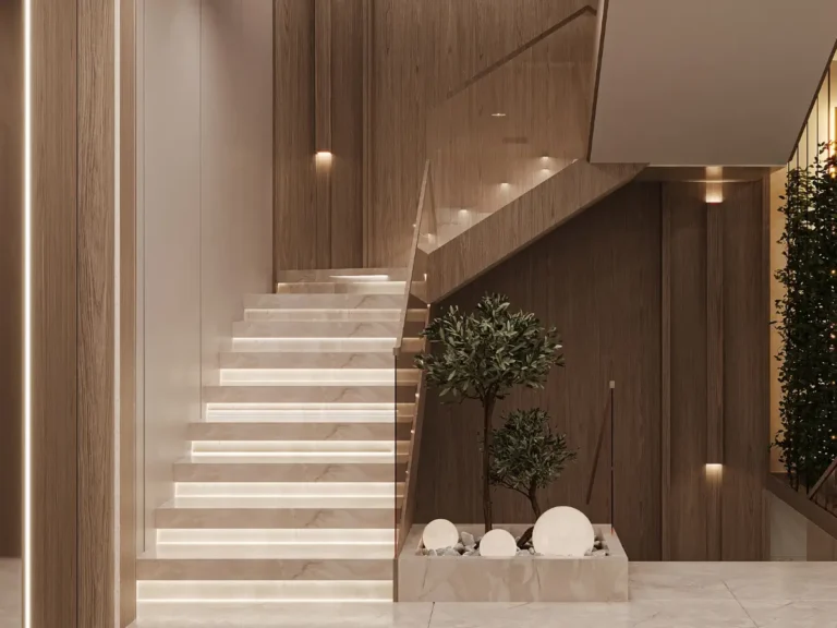 تصميم درج فيلا يتميز بدرجات رخامية أنيقة ودرابزين معدني مزخرف وثريا كلاسيكية.