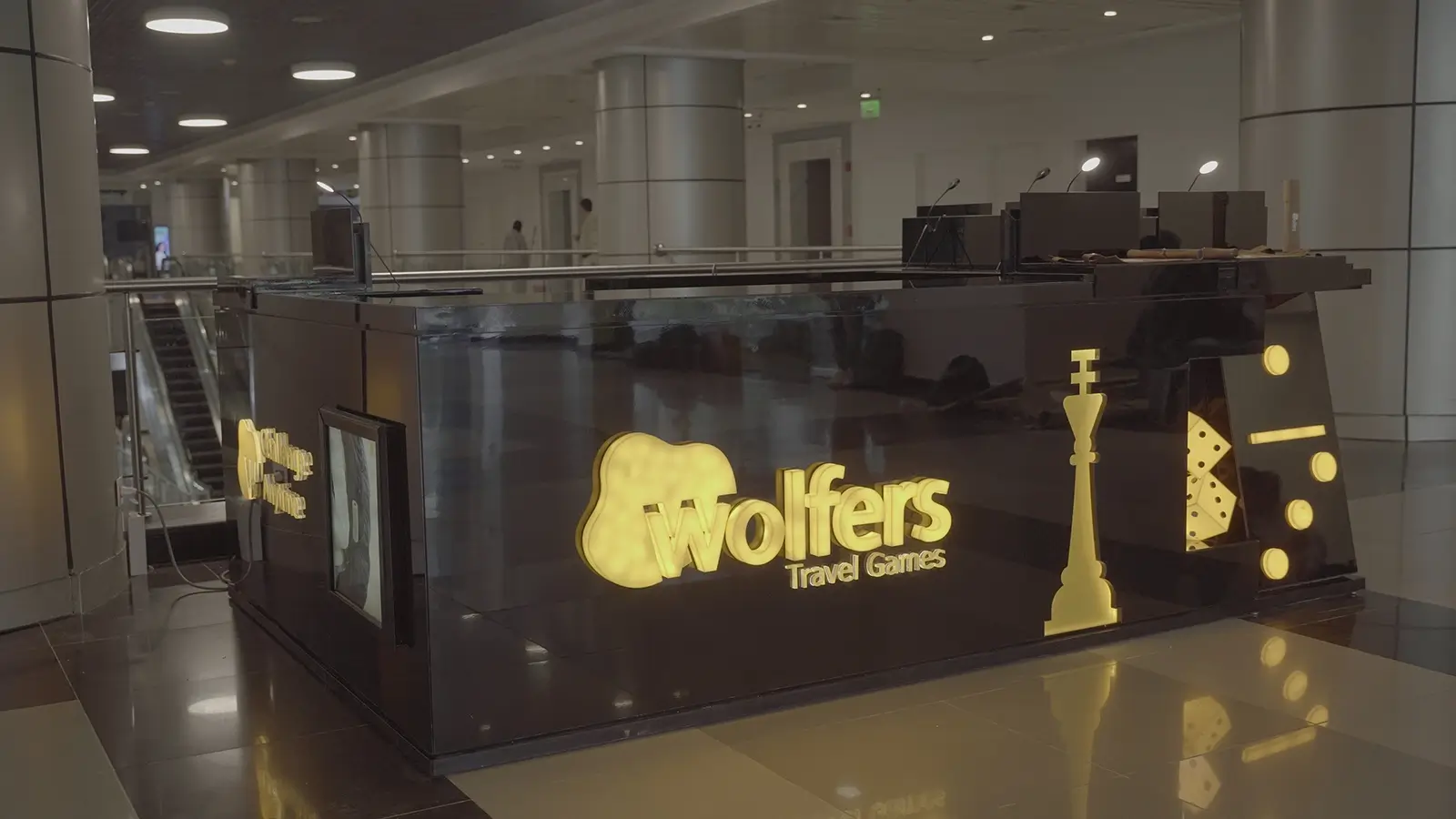 Exhibition booth design for Wolfers Travel Games with custom branding and product displays